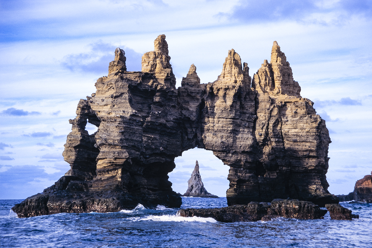 Rock formation off Clarion Island. Clarion Island is the most distant island of the four islands that make up the Isla Revillagigedos (Socorro Islands as they are more commonly called) off of the Pacific Ocean side of Mexico.