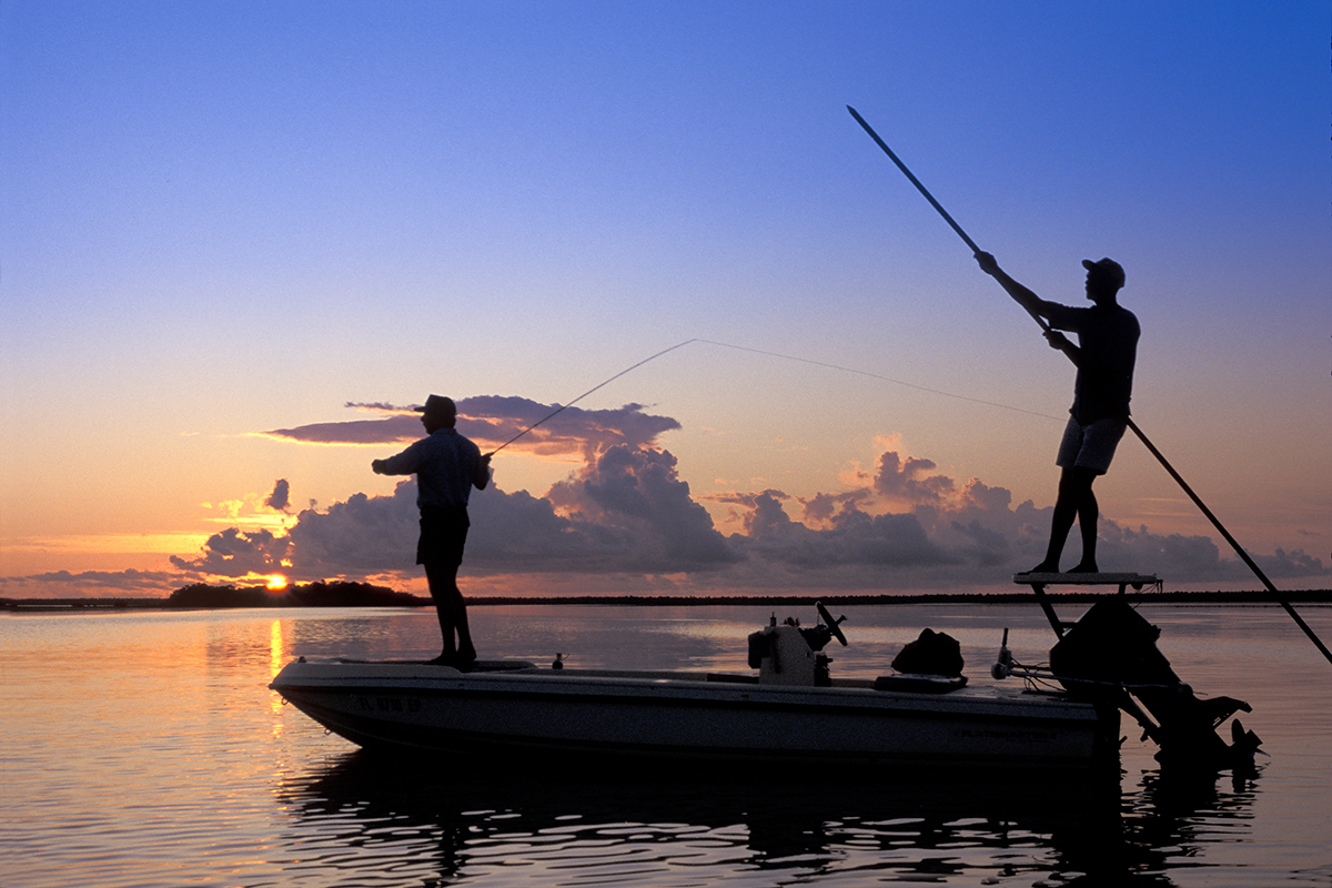 Poling the flats in the Bahamas for bonefish at sunrise.